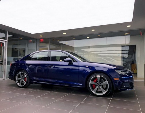 audi (4) blue car under recessed lit panel