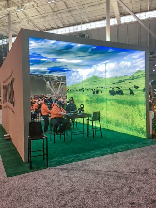 US Foods Trade Show SEG lightbox freestanding archway with seating and double-sided graphics and turf