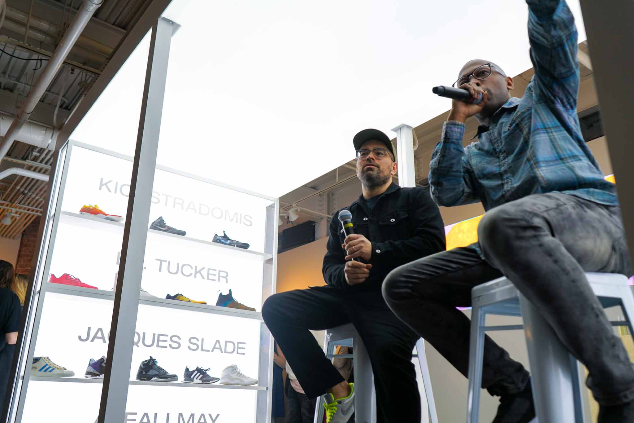 Two men talking inside custom Lightbox stage